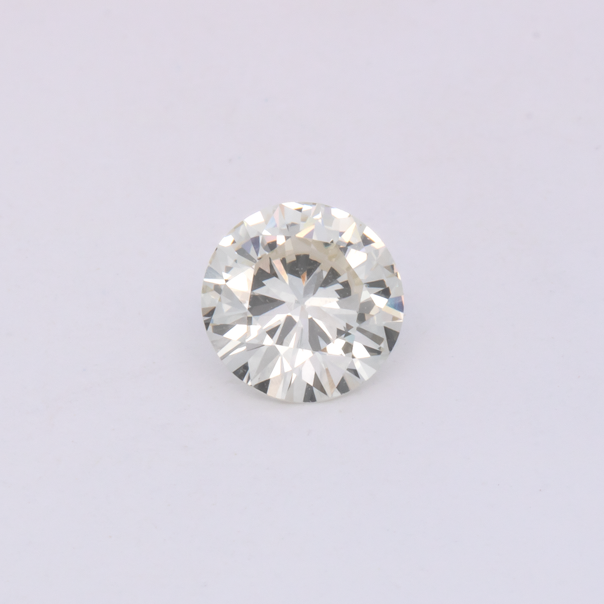 Diamond - slightly tinted yellow, round, 5.6x5.6 mm, 0.60 ct, No. DT1016