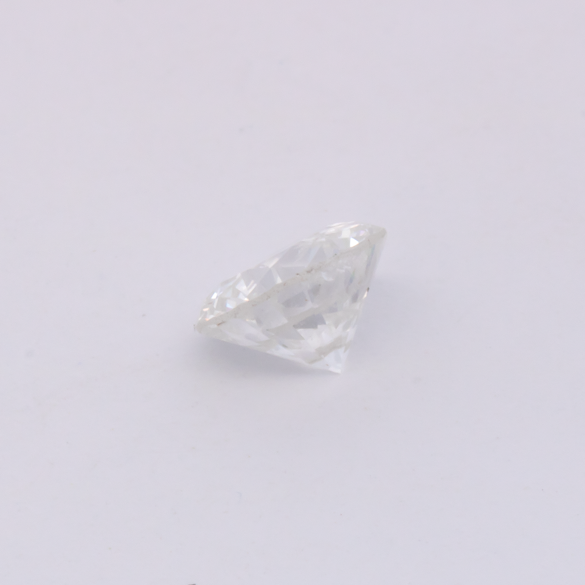 Diamond - slightly tinted yellow, round, 5.2x5.2 mm, 0.57 ct, No. DT1017
