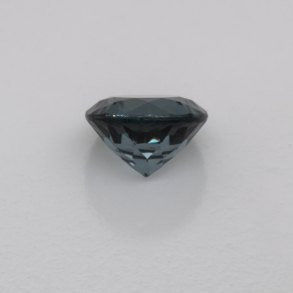 Spinell - grau, rund, 5.1x5.1 mm, 0.60 ct, Nr. SP90056